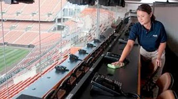 Person cleaning in a sport arena setting