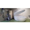 Large capsule-looking object filled with water which is a float tank used for therapy in hospital setting