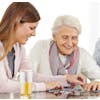 Woman and older woman doing puzzle