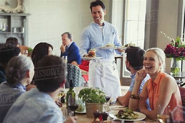 Person taking food orders & serving in dining room