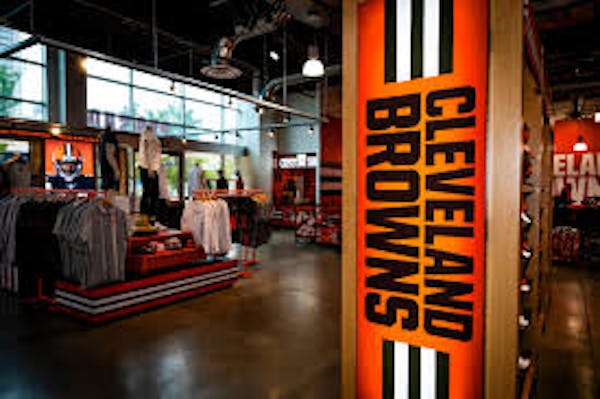 Cleveland Browns team shop with merchandise on shelves and hangers.